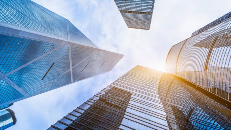 Tall bank skyscrapers underneath a blue sky