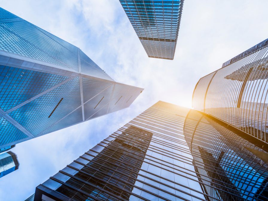 Tall bank skyscrapers underneath a blue sky