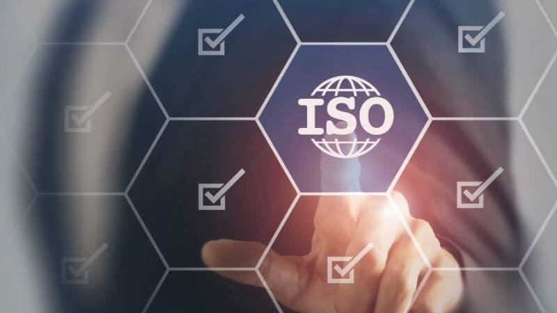 Hand pushing a button that reads ISO