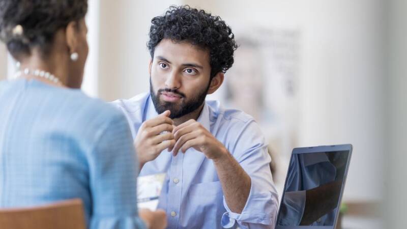 Banker discussing strategy with client