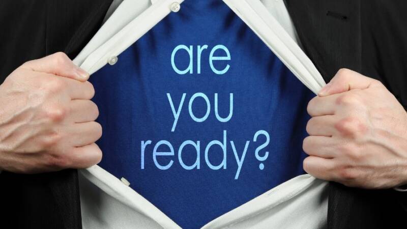 Business man opening shirt to reveal Are You Ready words