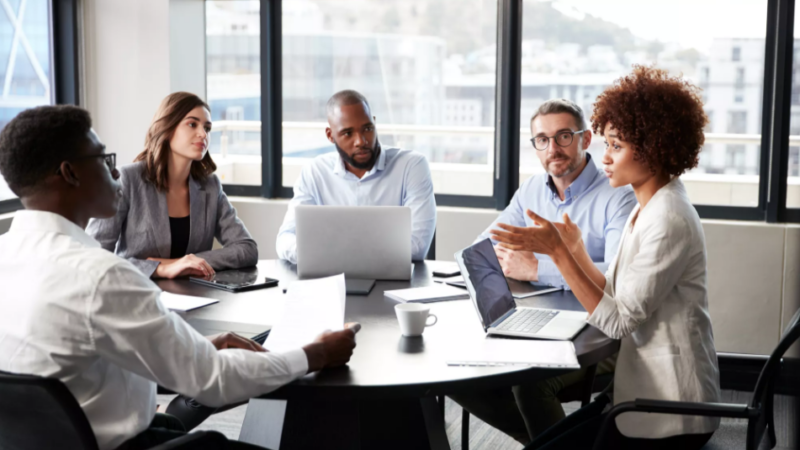 Group of bankers discussing strategy at an office table