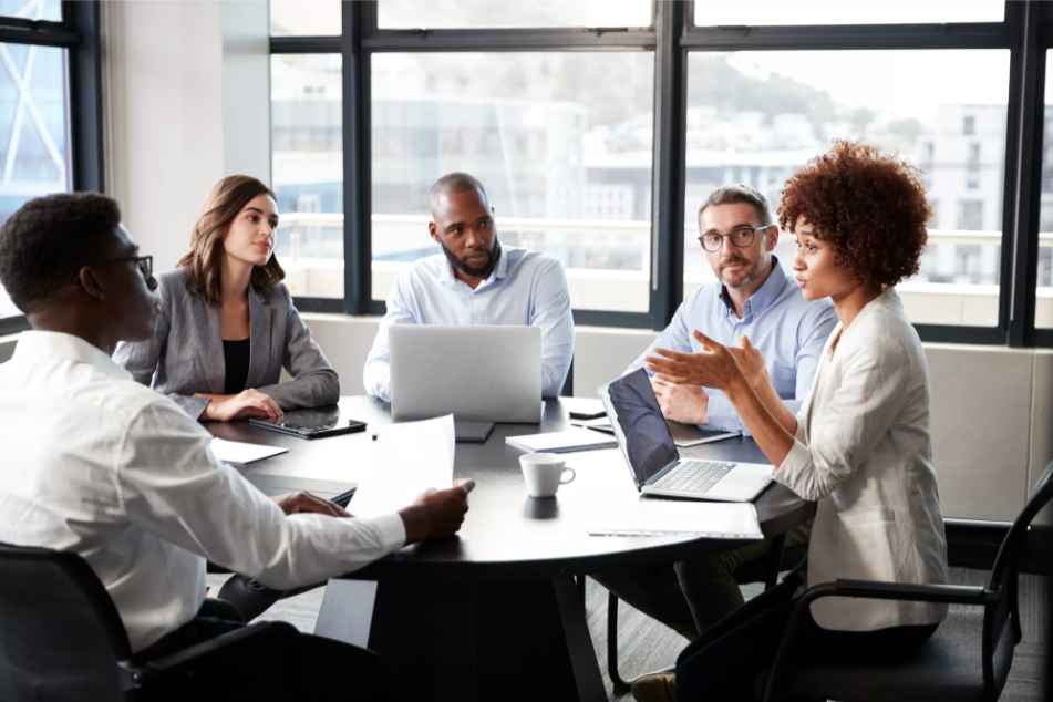 Group of bankers discussing strategy at an office table